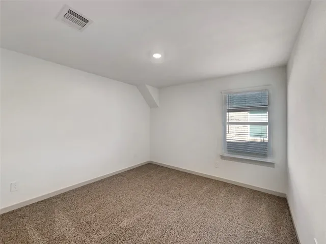 a kitchen with stainless steel appliances granite countertop a stove a refrigerator and a microwave