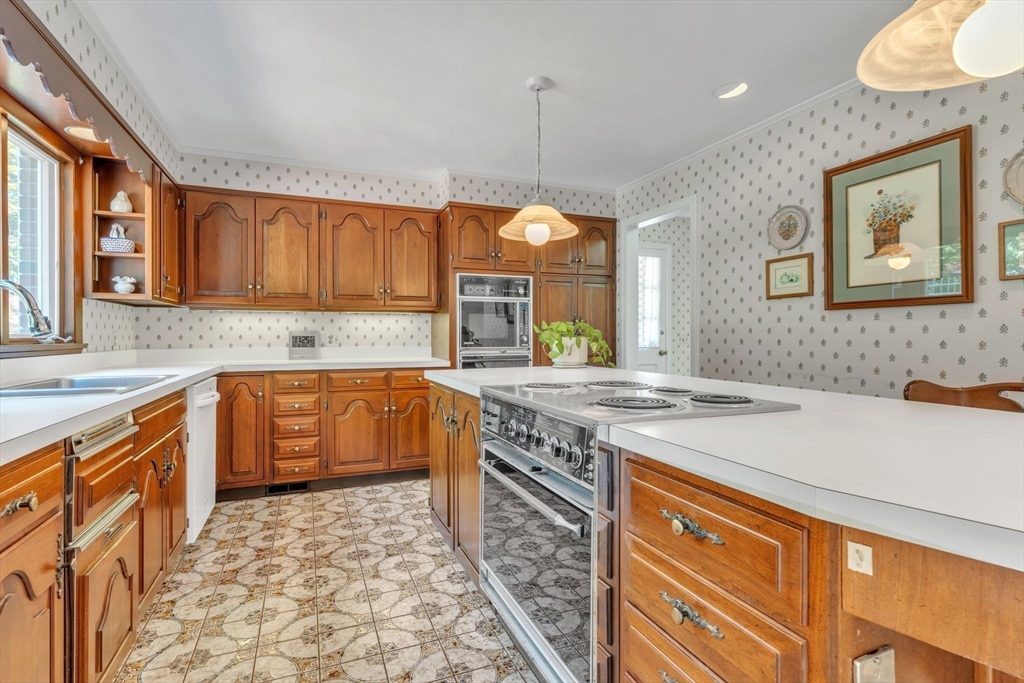 63 Ardsley Road Longmeadow, MA 01106 - Photo 13 of 41 a kitchen with stainless steel appliances granite countertop a sink stove and cabinets