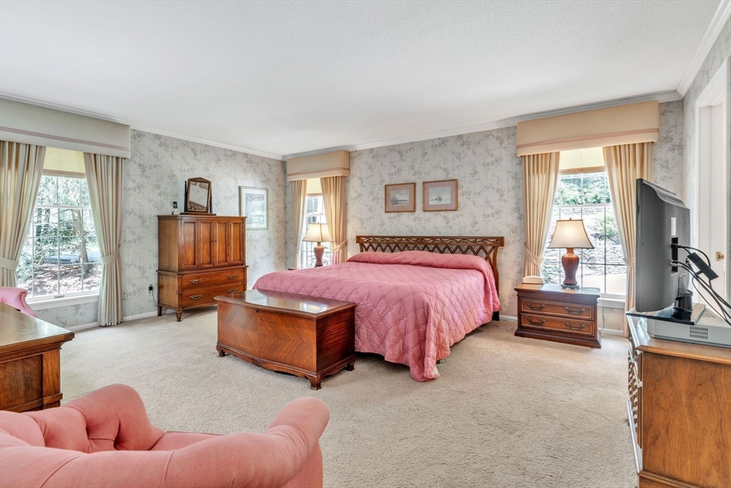 63 Ardsley Road Longmeadow, MA 01106 - Photo 17 of 41 a spacious bedroom with a bed and a couch