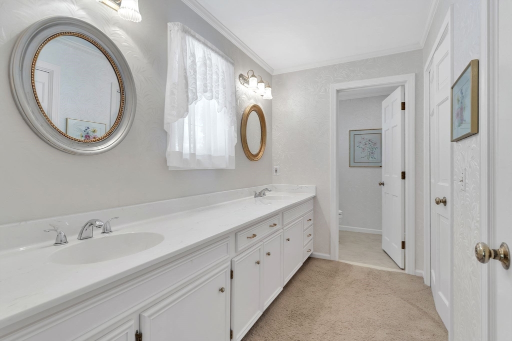 63 Ardsley Road Longmeadow, MA 01106 - Photo 20 of 41 a bathroom with a double vanity sink and a mirror
