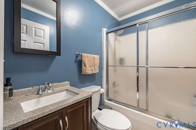 11623 Cox Road Church Road, VA 23833 - Photo 21 of 41 a bathroom with a granite countertop sink toilet a mirror and shower