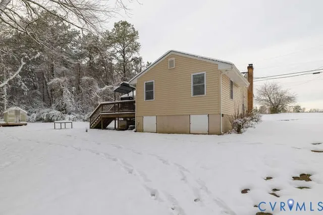 a view of backyard with a table and chairs