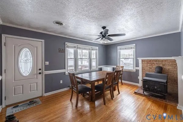 a view of a dining room with furniture window and wooden floor