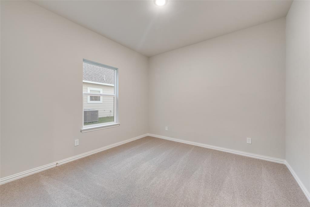 3709 Washington Street Greenville, TX 75401 - Photo 17 of 24 an empty room with a window