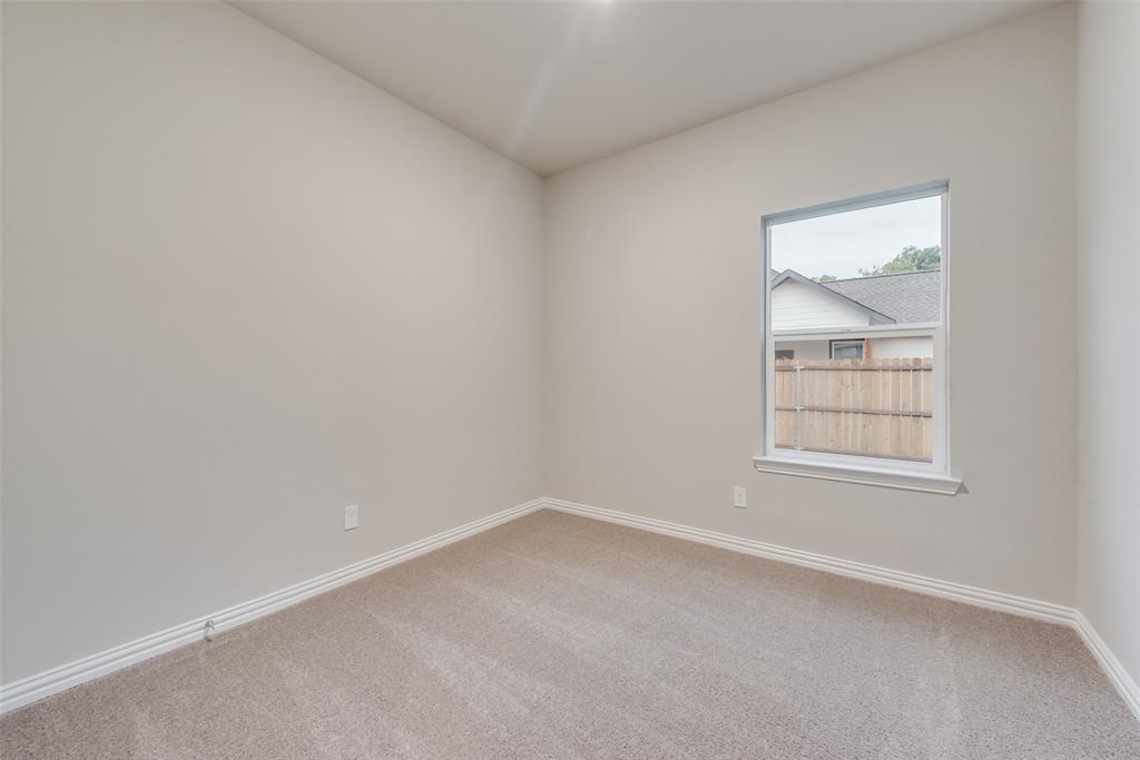 3709 Washington Street Greenville, TX 75401 - Photo 18 of 24 an empty room with a window