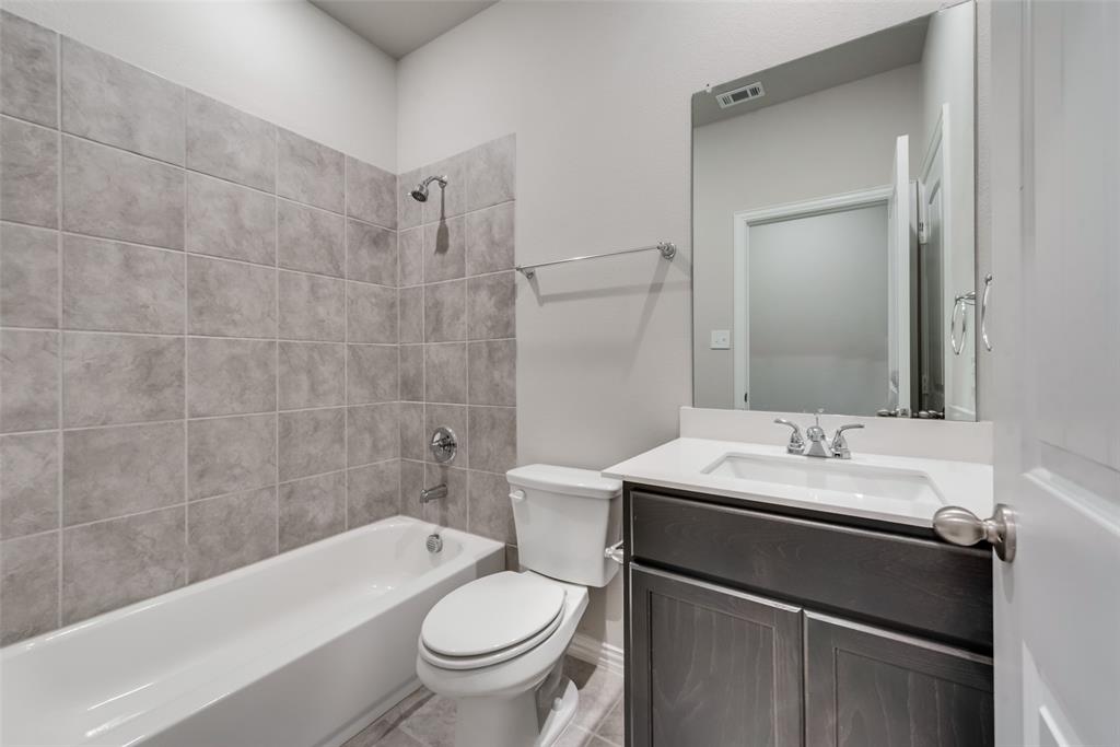 3709 Washington Street Greenville, TX 75401 - Photo 19 of 24 a bathroom with a sink toilet and shower