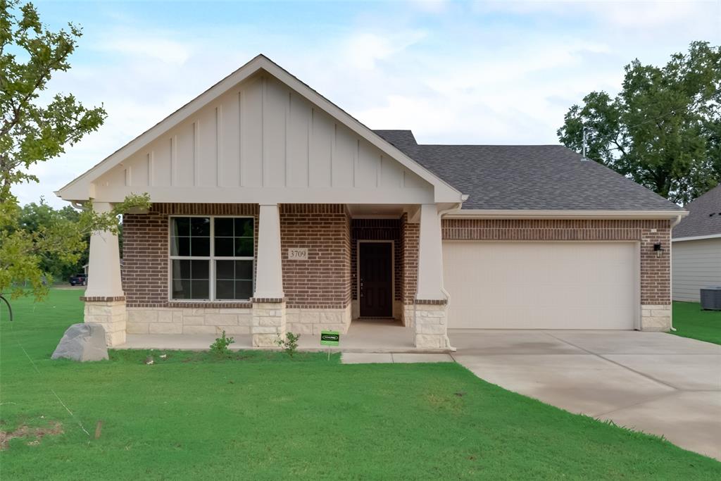 3709 Washington Street Greenville, TX 75401 - Photo 2 of 24 front view of a house with a yard
