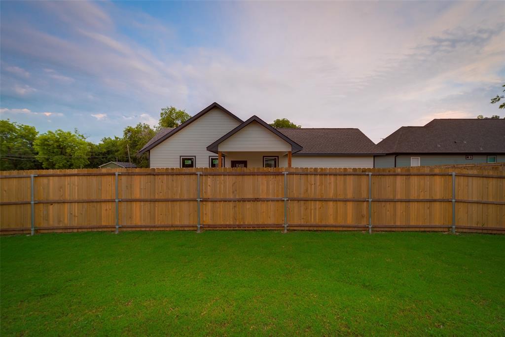3709 Washington Street Greenville, TX 75401 - Photo 23 of 24 a view of a yard with wooden fence