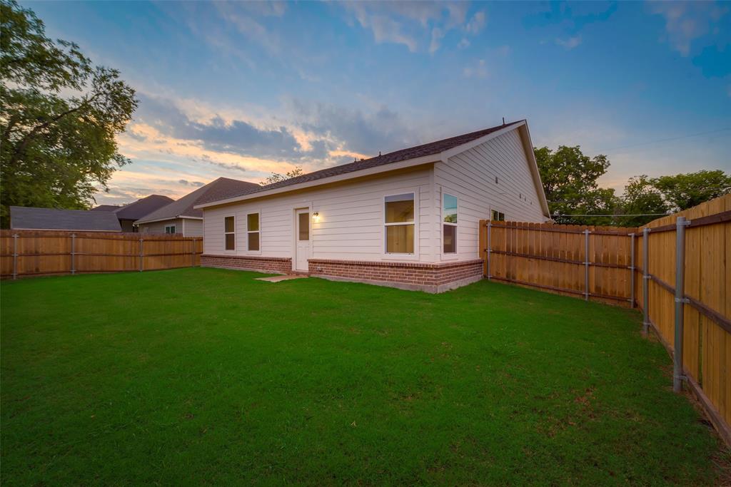 3709 Washington Street Greenville, TX 75401 - Photo 24 of 24 a view of a house with backyard and garden