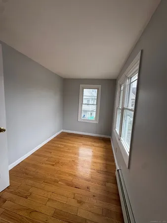 a view of an empty room and glass door