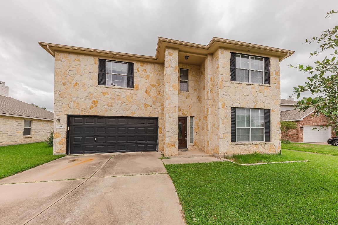 101 Bushmaster Bend Bastrop, TX 78602 - Photo 1 of 1 a front view of a house with garden