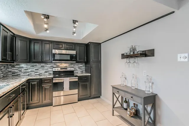 a room with wooden floor and furniture