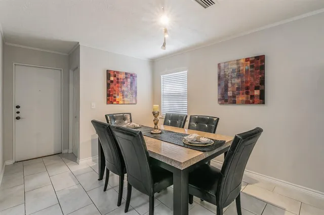 a room with a dresser and a window