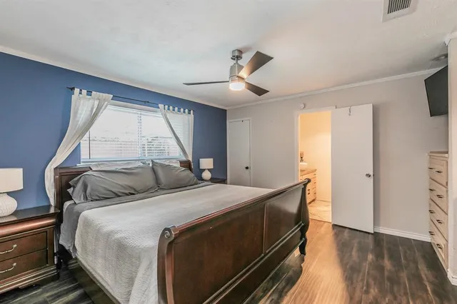 a white toilet sitting next to a shower