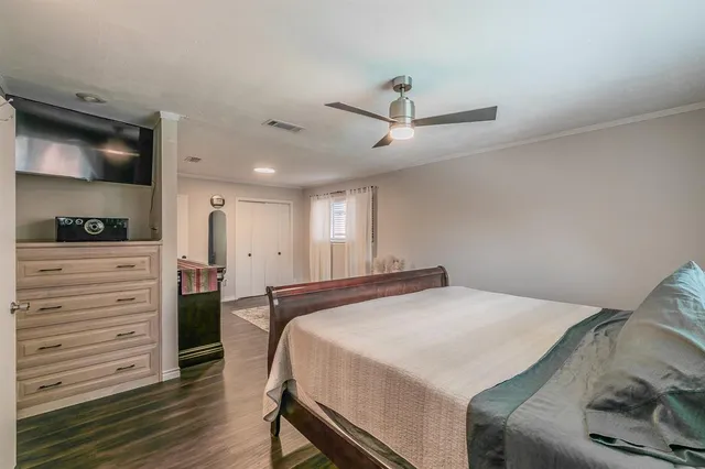 a view of a room with wooden floor and stairs