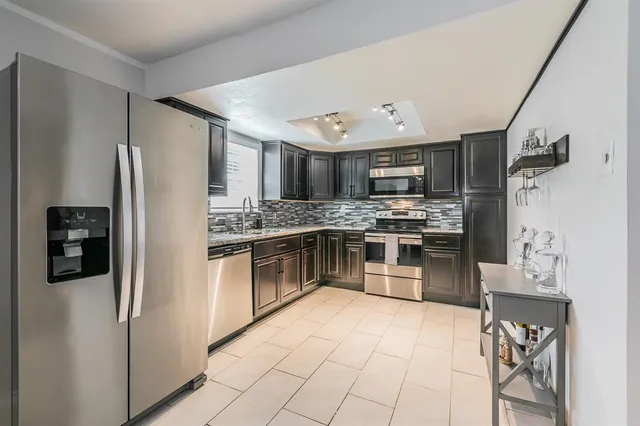 a view of a dining room with furniture and a window