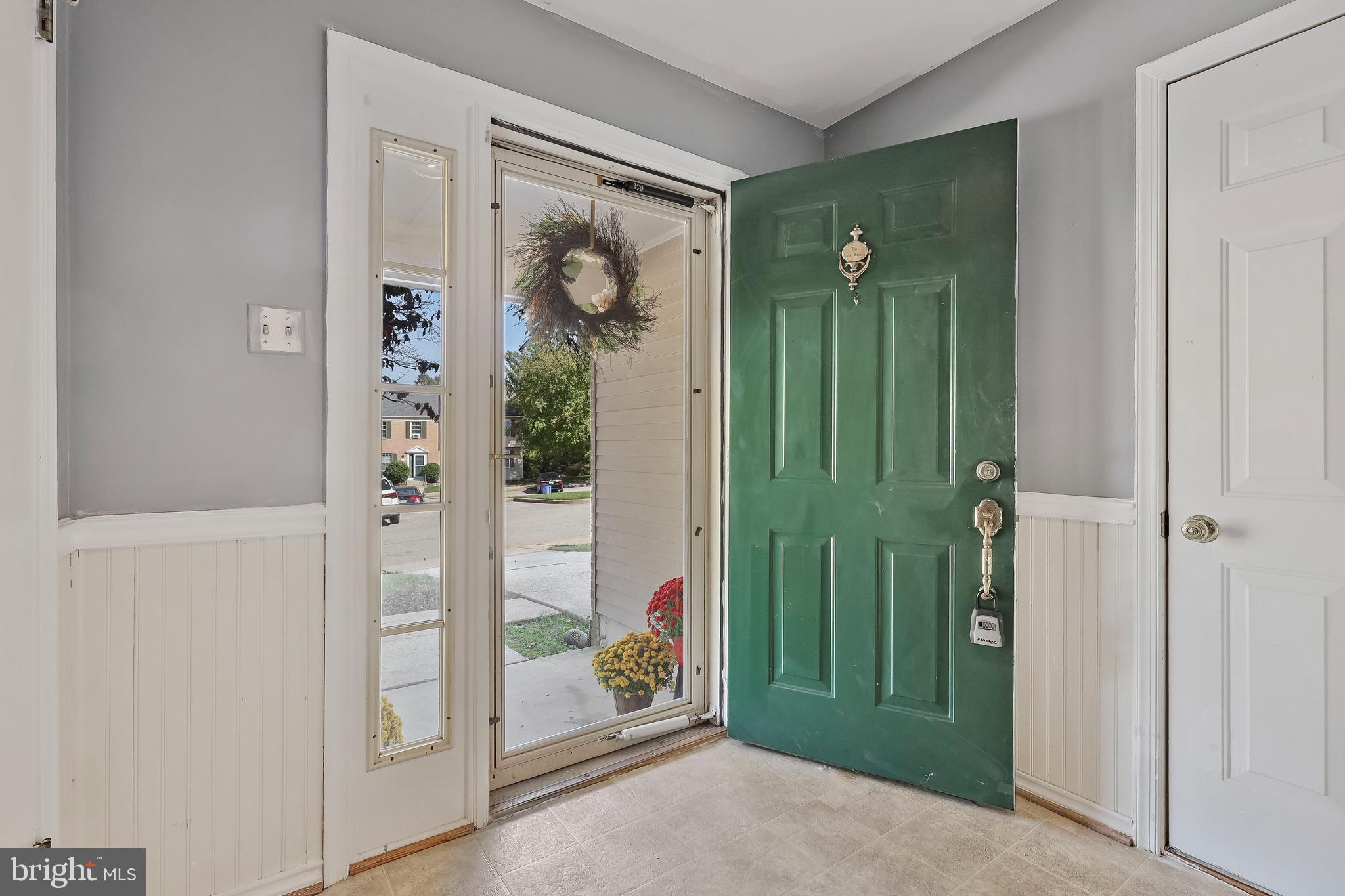 8722 Ruppert Court Ellicott City, MD 21043 - Photo 6 of 36 Open Foyer with Large Coat Closet & Garage Access
