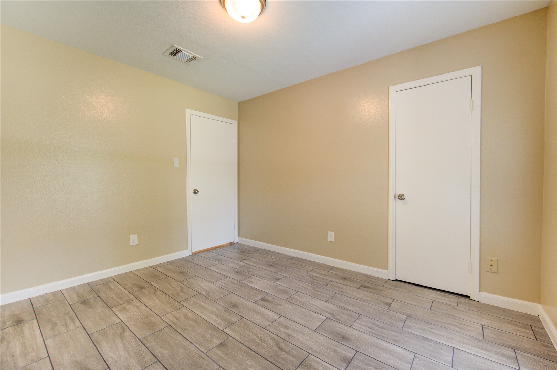 3702 Royal Manor Drive Houston, TX 77082 - Photo 15 of 29 a view of an empty room with wooden floor