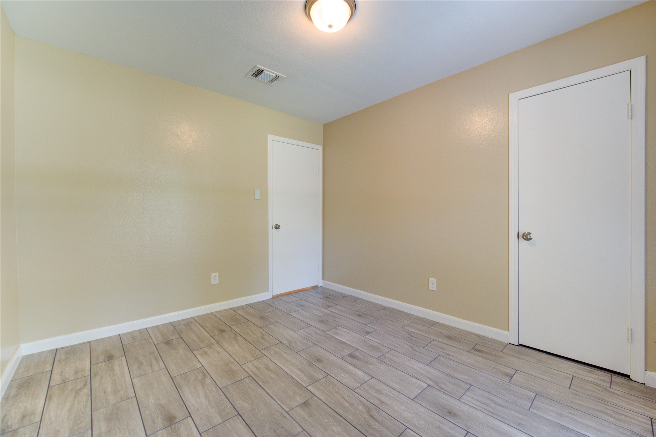 3702 Royal Manor Drive Houston, TX 77082 - Photo 16 of 29 a view of an empty room with wooden floor