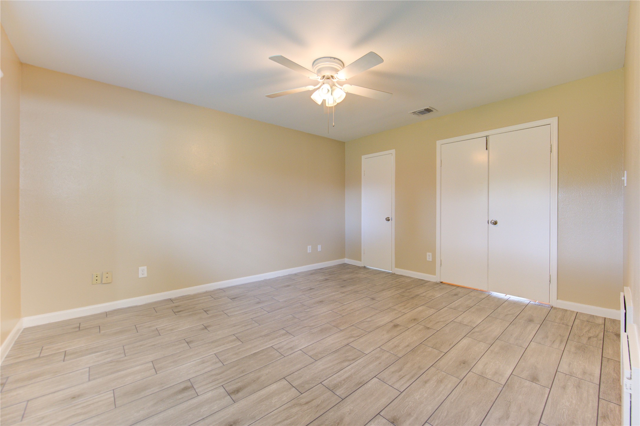 3702 Royal Manor Drive Houston, TX 77082 - Photo 20 of 29 a view of an empty room with wooden floor