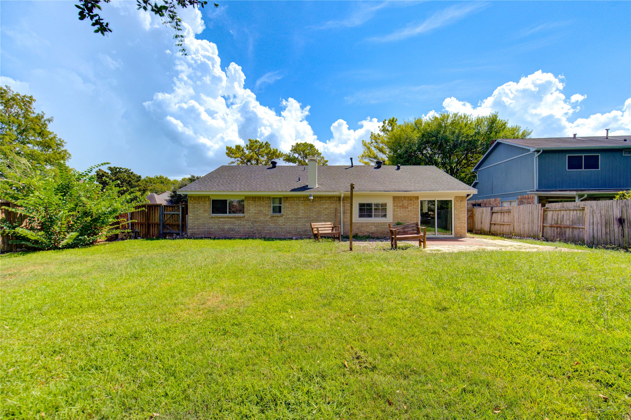 3702 Royal Manor Drive Houston, TX 77082 - Photo 28 of 29 a front view of a house with a garden and plants