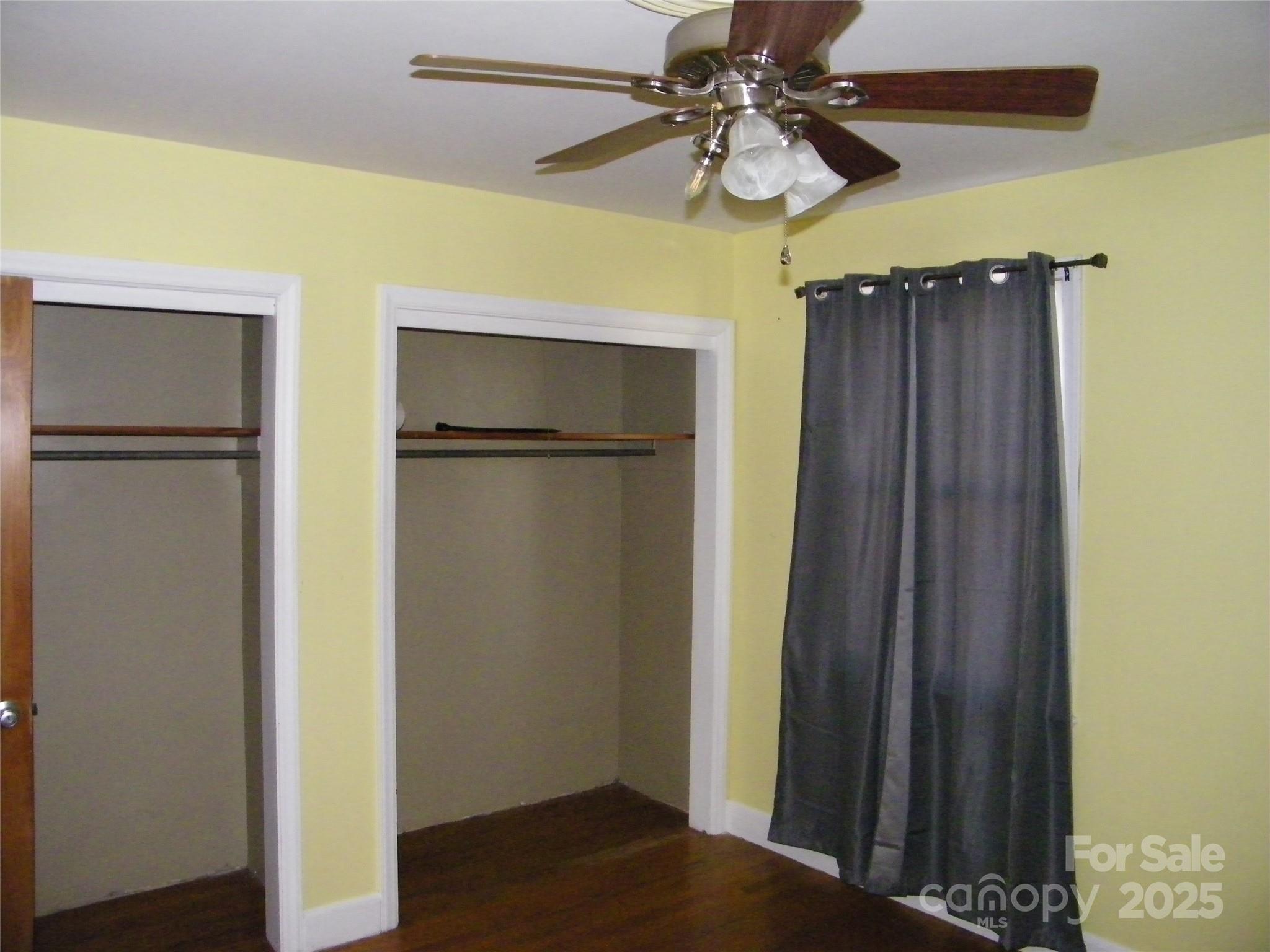 2353 South Post Road Shelby, NC 28152 - Photo 18 of 31 a view of a room with closet and chandelier fan