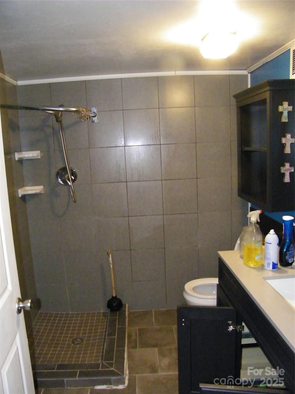 2353 South Post Road Shelby, NC 28152 - Photo 21 of 31 a bathroom with a sink toilet and shower