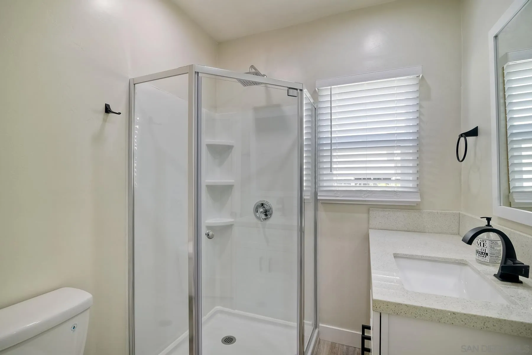 4685 Hamilton Street San Diego, CA 92116 - Photo 17 of 37 a bathroom with a shower and a sink