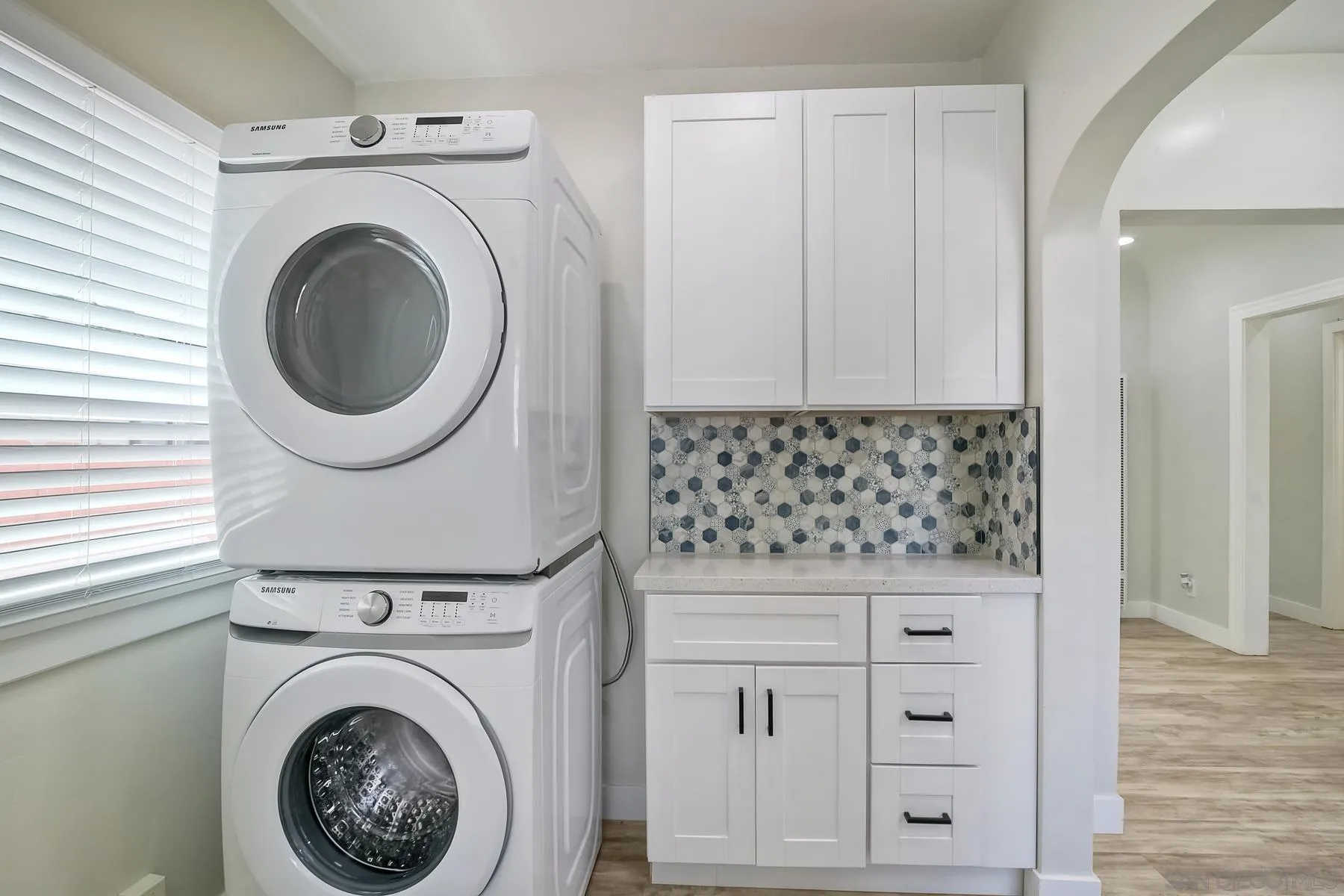 4685 Hamilton Street San Diego, CA 92116 - Photo 24 of 37 a view of a kitchen with washer and dryer