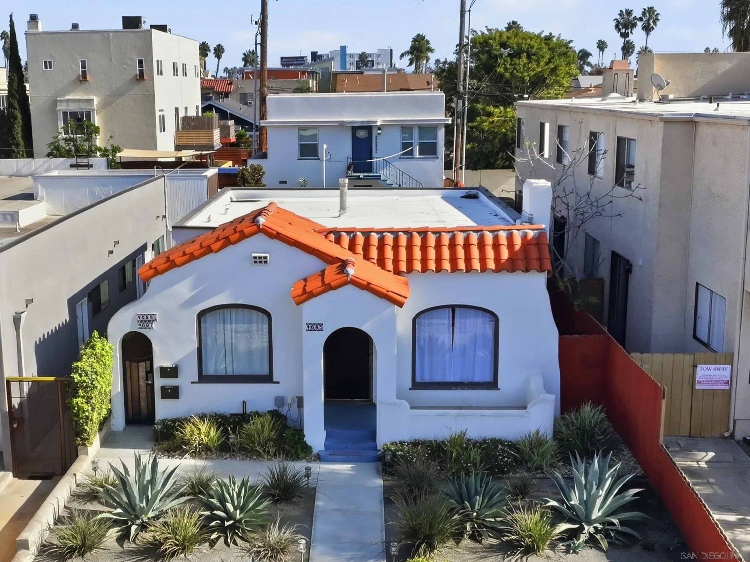 4685 Hamilton Street San Diego, CA 92116 - Photo 5 of 37 a front view of house with yard outdoor seating and barbeque oven