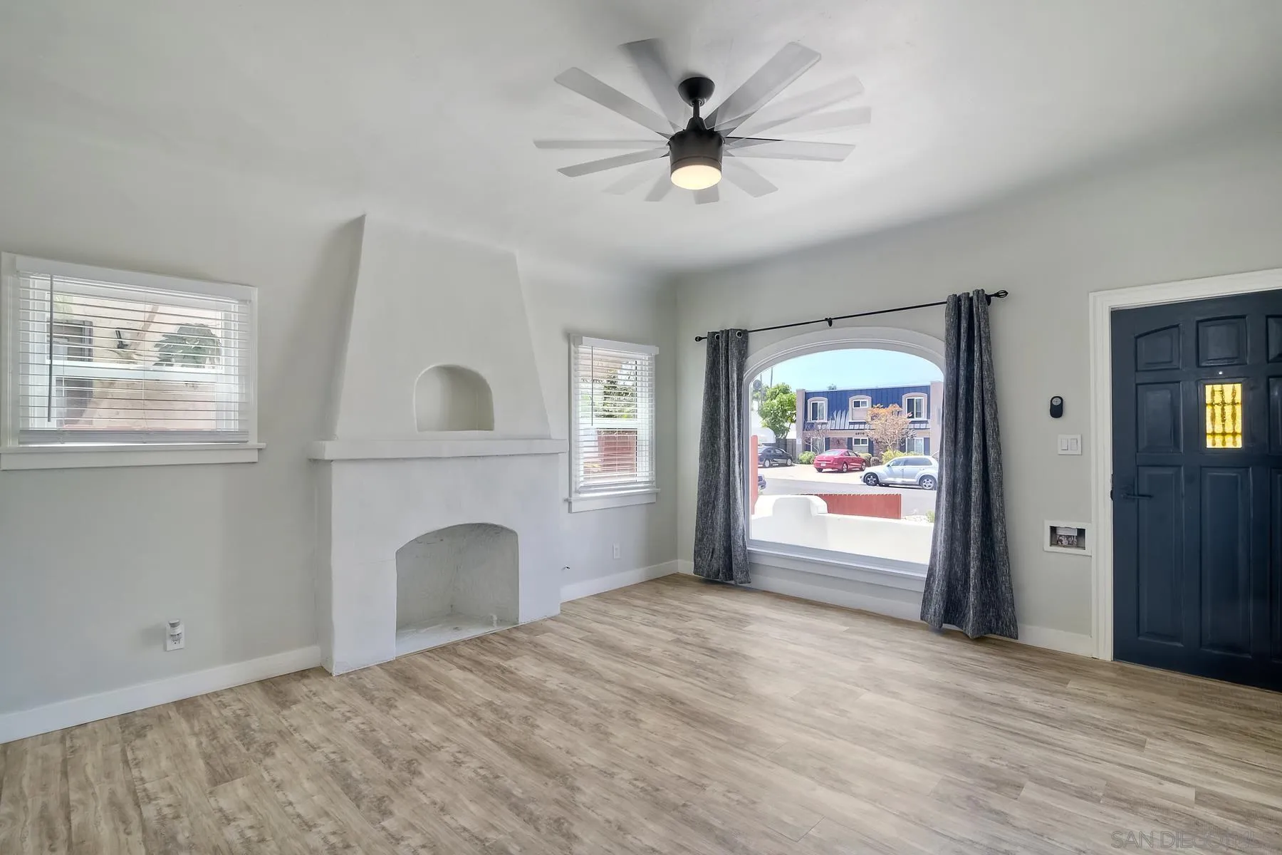 4685 Hamilton Street San Diego, CA 92116 - Photo 10 of 37 a view of an empty room with window and cabinet