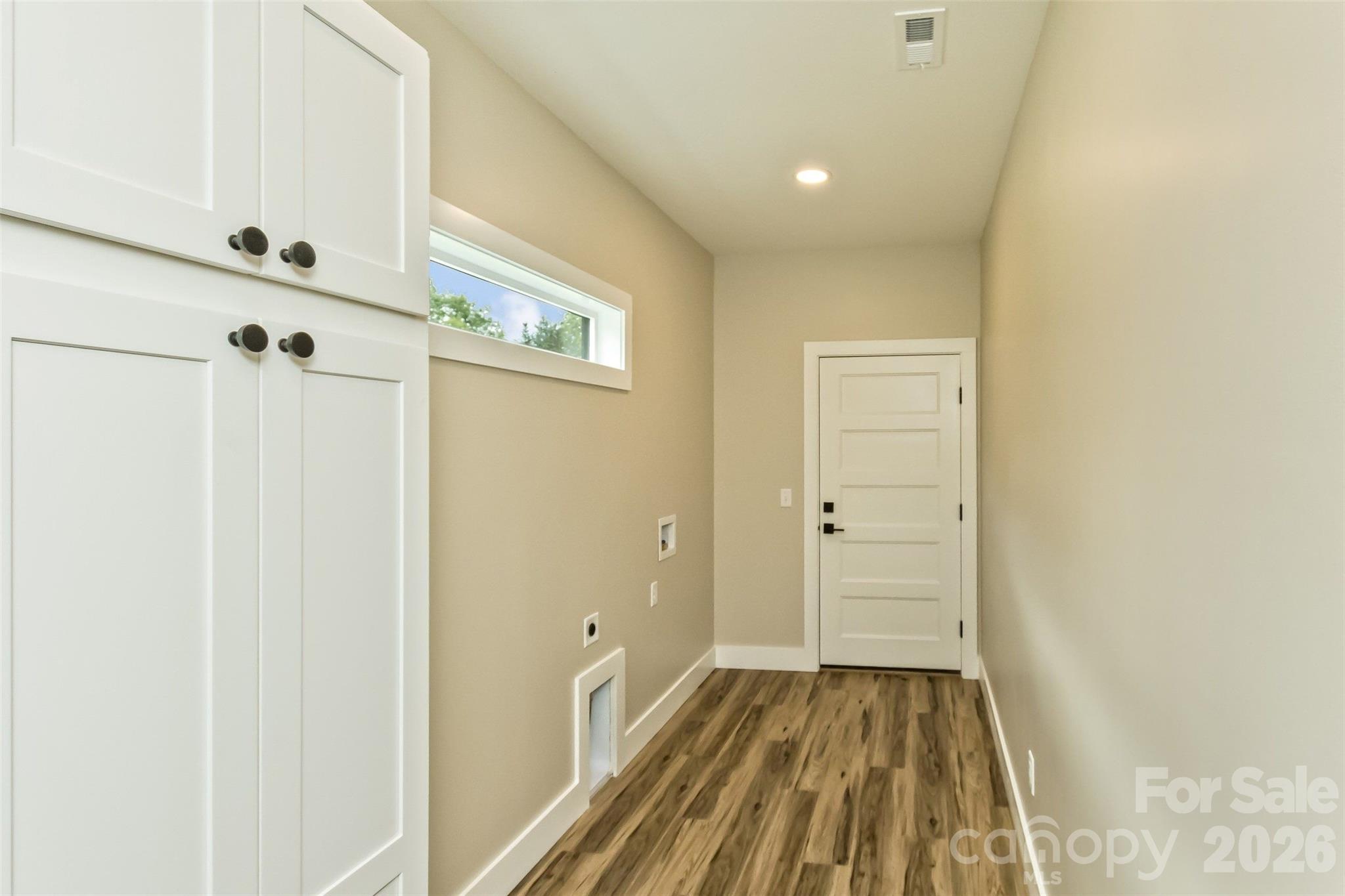 112 Peyton Elaine Road Clyde, NC 28721 - Photo 12 of 35 a view of a hallway with wooden floor and closet