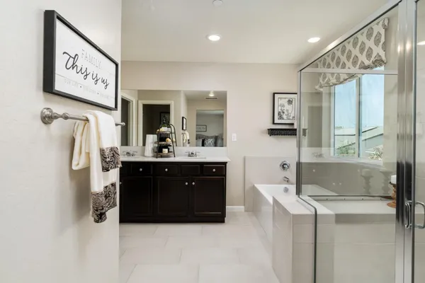 a bathroom with a sink vanity and a mirror