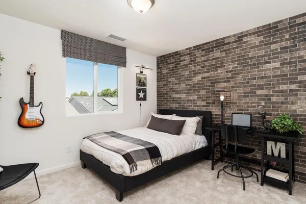 a bedroom with a bed and a table