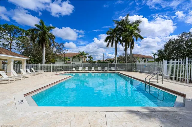 a view of a swimming pool with a lounge chairs