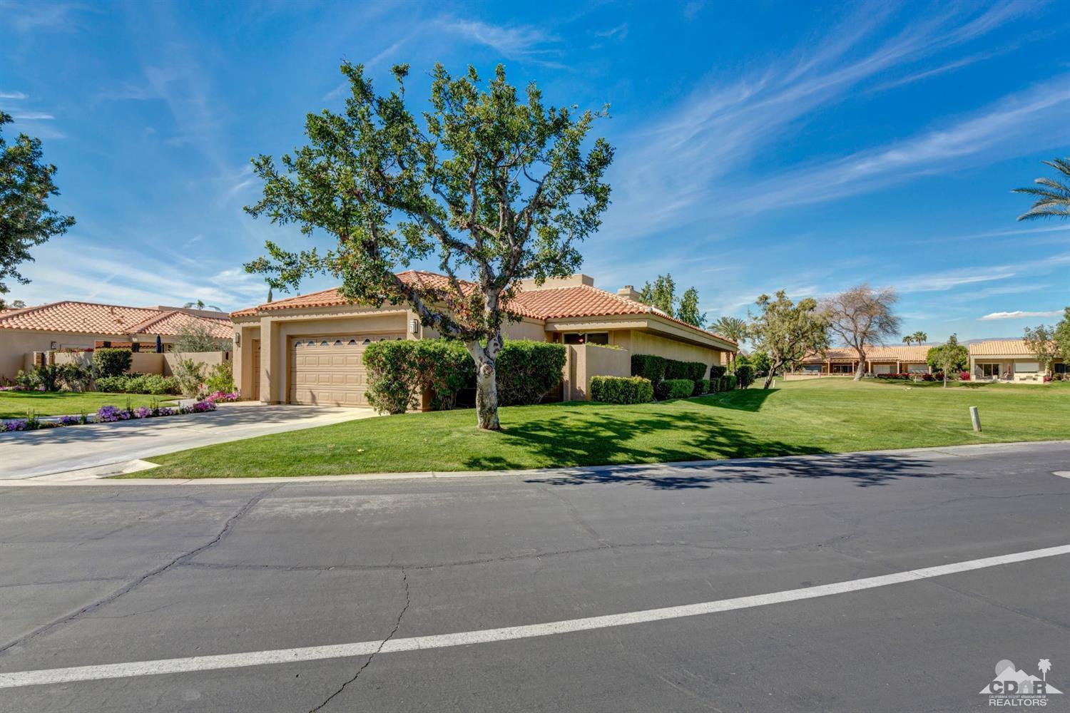 2 Hilton Head Drive Rancho Mirage, CA 92270 - Photo 1 of 40 a front view of a house with a yard and potted plants