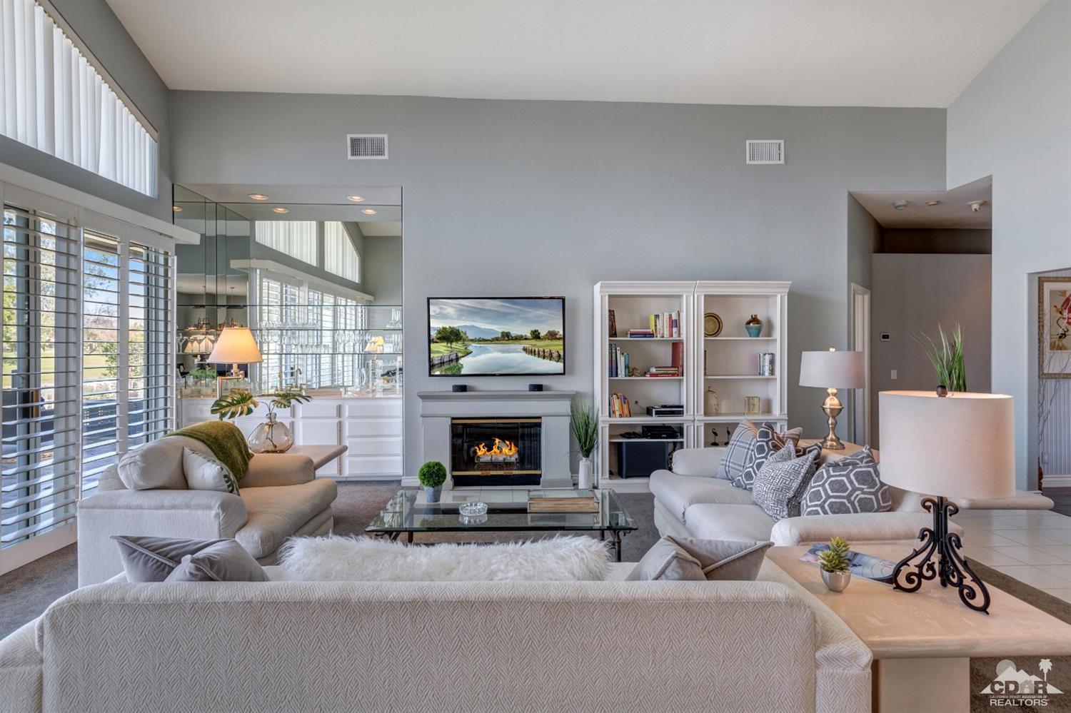 2 Hilton Head Drive Rancho Mirage, CA 92270 - Photo 13 of 40 a living room with furniture and a fireplace