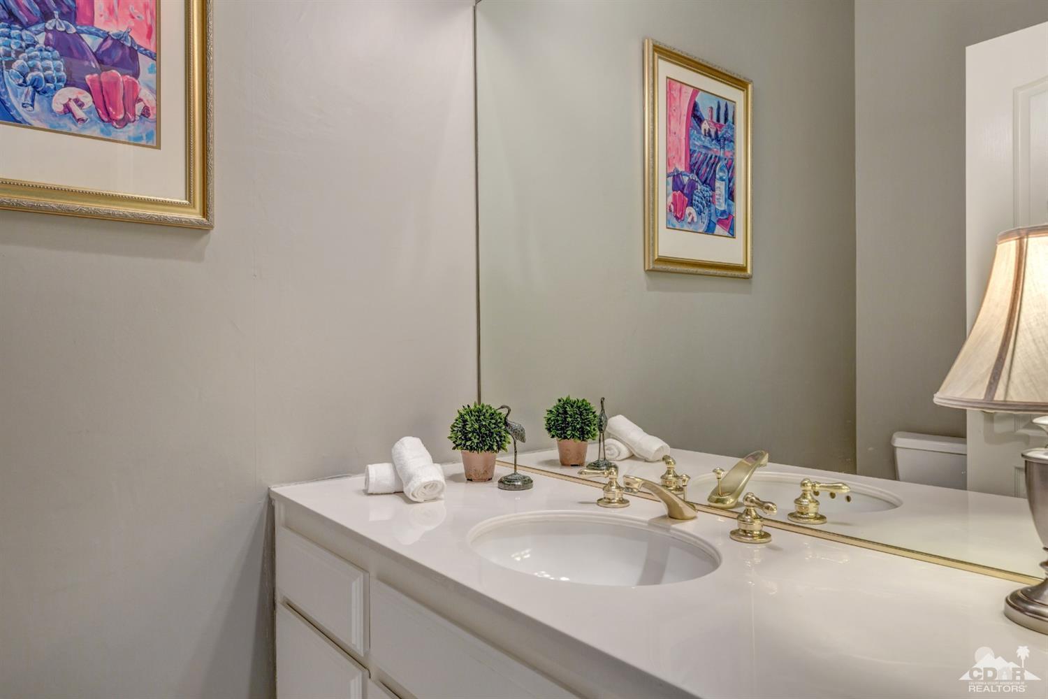 2 Hilton Head Drive Rancho Mirage, CA 92270 - Photo 21 of 40 a bathroom with a sink and a mirror