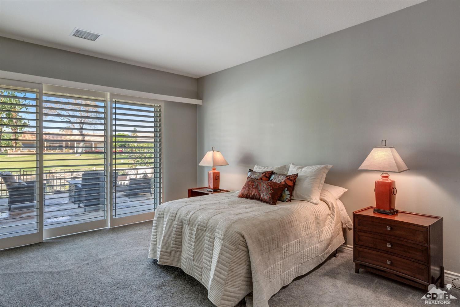 2 Hilton Head Drive Rancho Mirage, CA 92270 - Photo 22 of 40 a bed room with a bed and a night stand