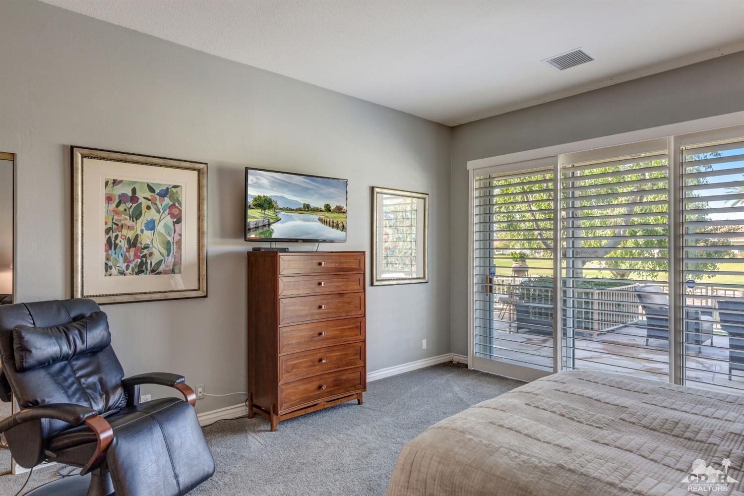 2 Hilton Head Drive Rancho Mirage, CA 92270 - Photo 23 of 40 a bedroom with a bed and furniture