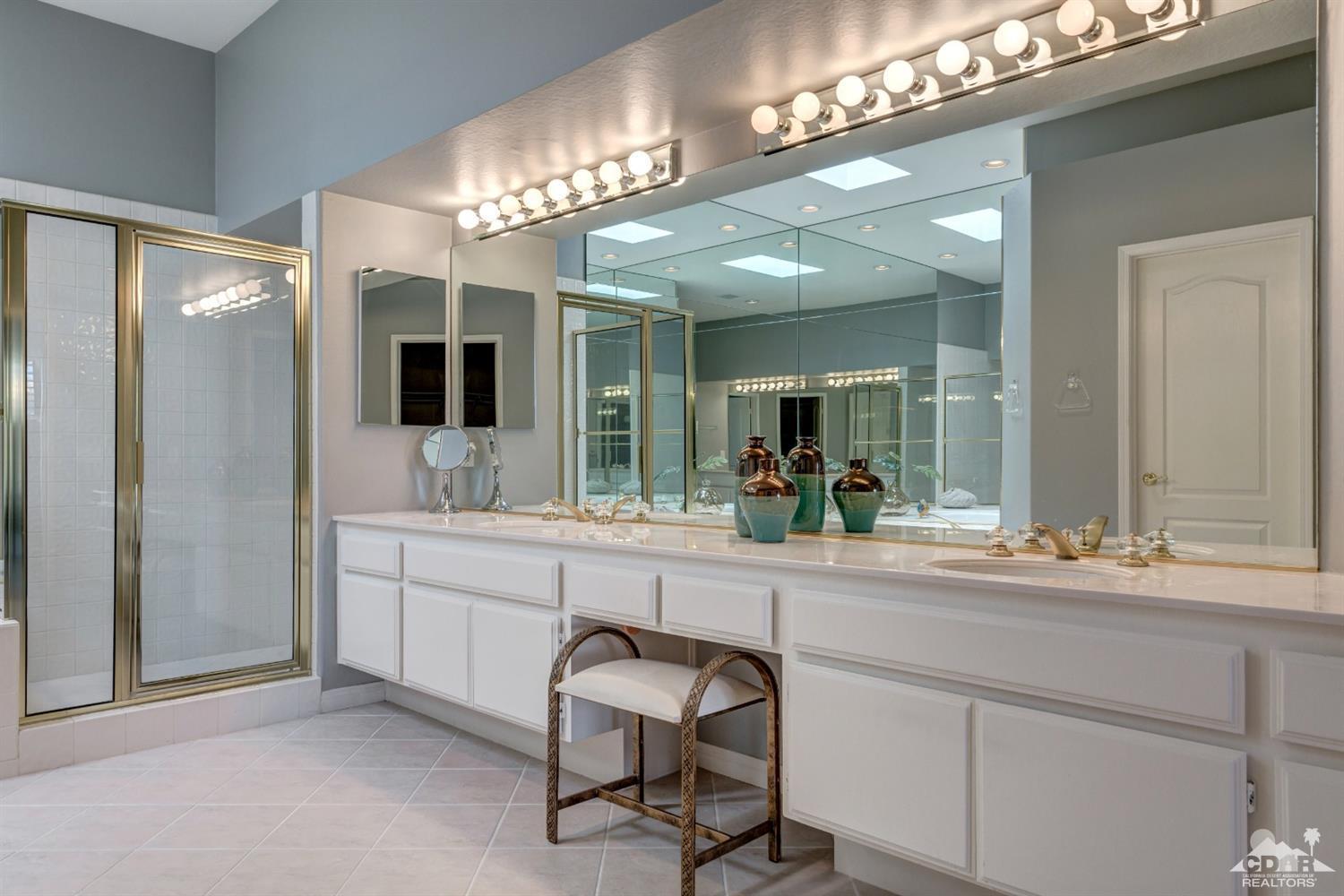2 Hilton Head Drive Rancho Mirage, CA 92270 - Photo 24 of 40 a spacious bathroom with a sink a large mirror and a shower