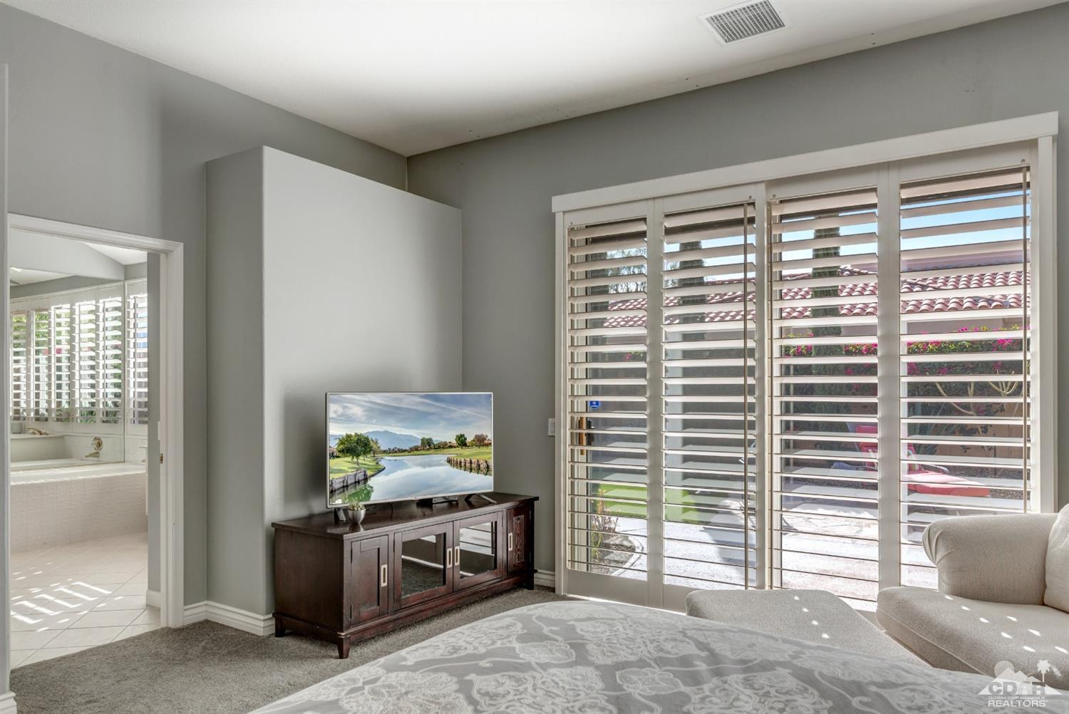 2 Hilton Head Drive Rancho Mirage, CA 92270 - Photo 27 of 40 a living room with furniture and a window
