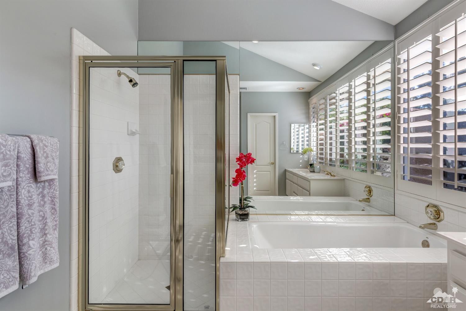 2 Hilton Head Drive Rancho Mirage, CA 92270 - Photo 29 of 40 a bathroom with a tub shower and a window