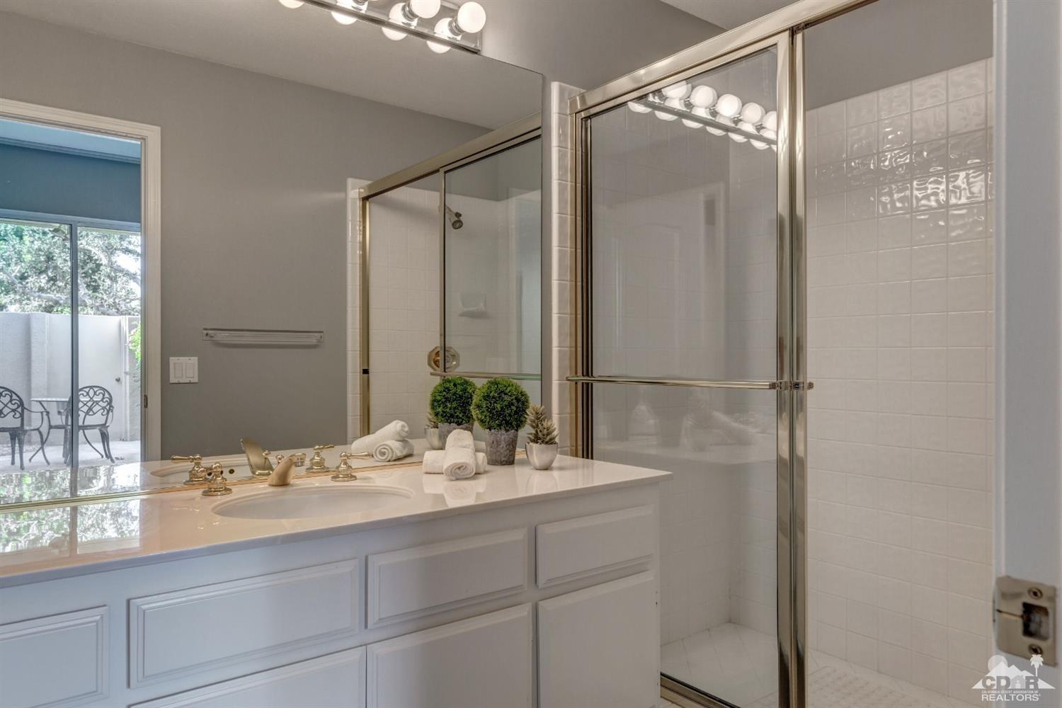 2 Hilton Head Drive Rancho Mirage, CA 92270 - Photo 32 of 40 a bathroom with a shower sink and mirror