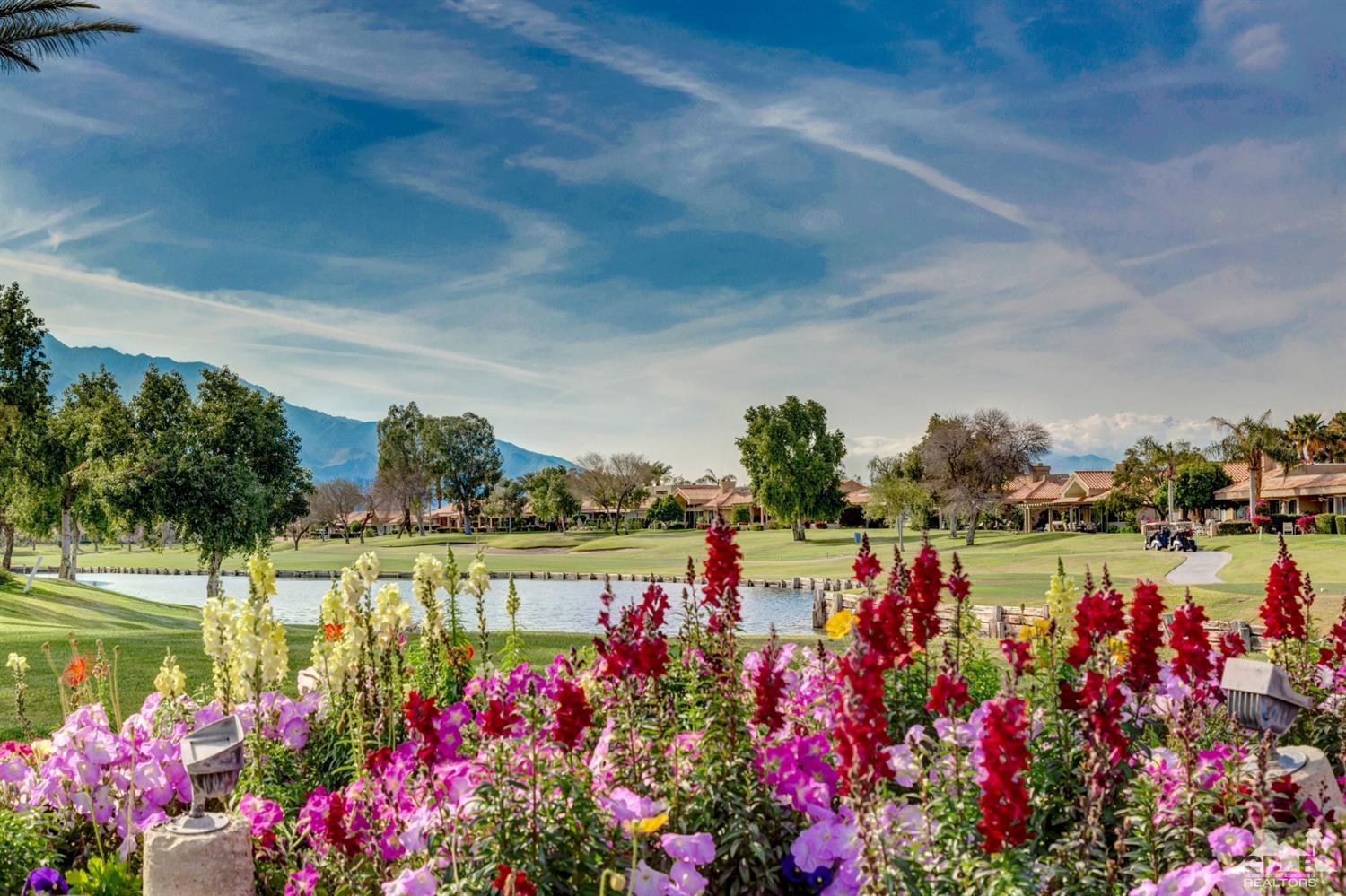 2 Hilton Head Drive Rancho Mirage, CA 92270 - Photo 39 of 40 a view of a lake with a lot of flowers