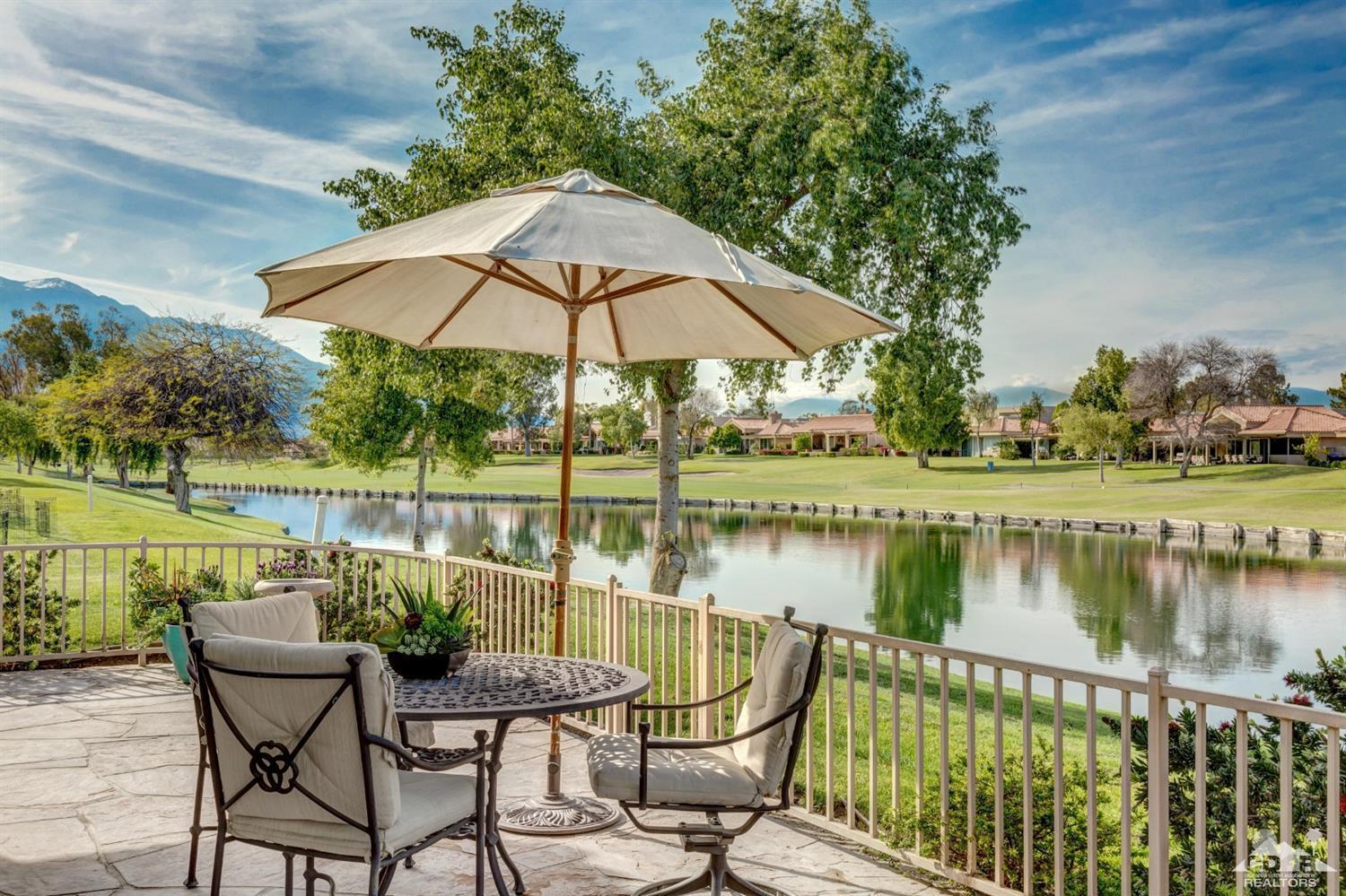 2 Hilton Head Drive Rancho Mirage, CA 92270 - Photo 5 of 40 a patio with water view fountain with wooden floor and lake view