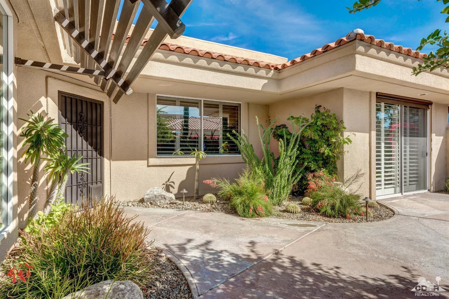 2 Hilton Head Drive Rancho Mirage, CA 92270 - Photo 9 of 40 a view of a house with potted plants