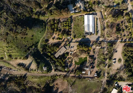 a view of a house with a tree