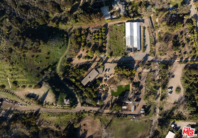a view of a house with a tree