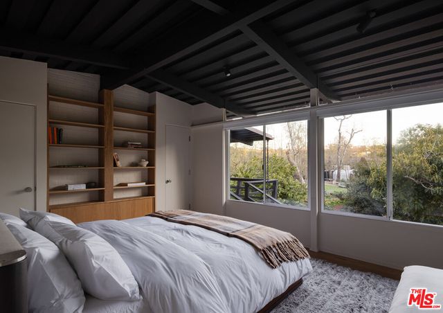 a view of a room with wooden floor and outdoor space